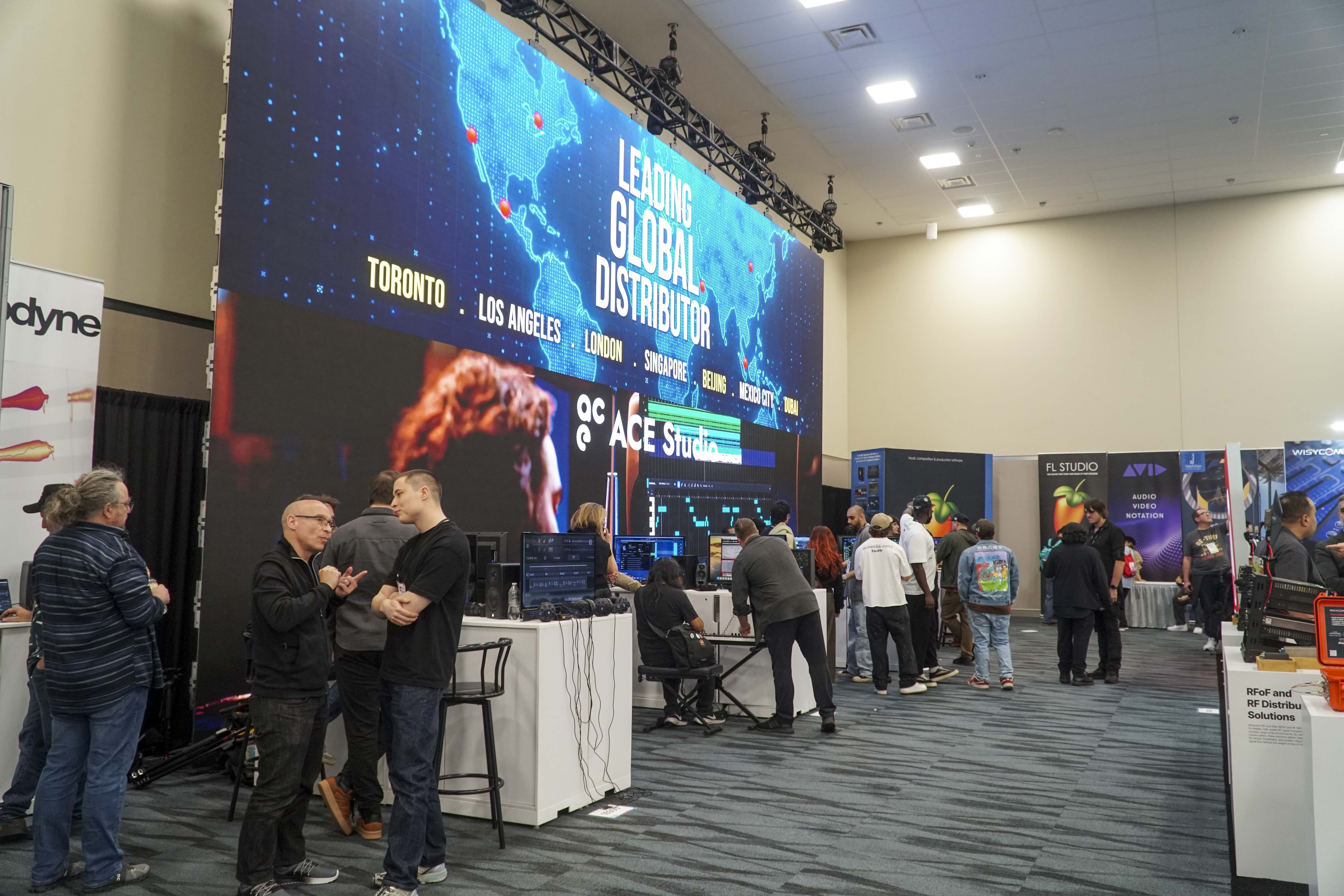 Visitors watching a software demonstration at the Music Marketing Inc. booth