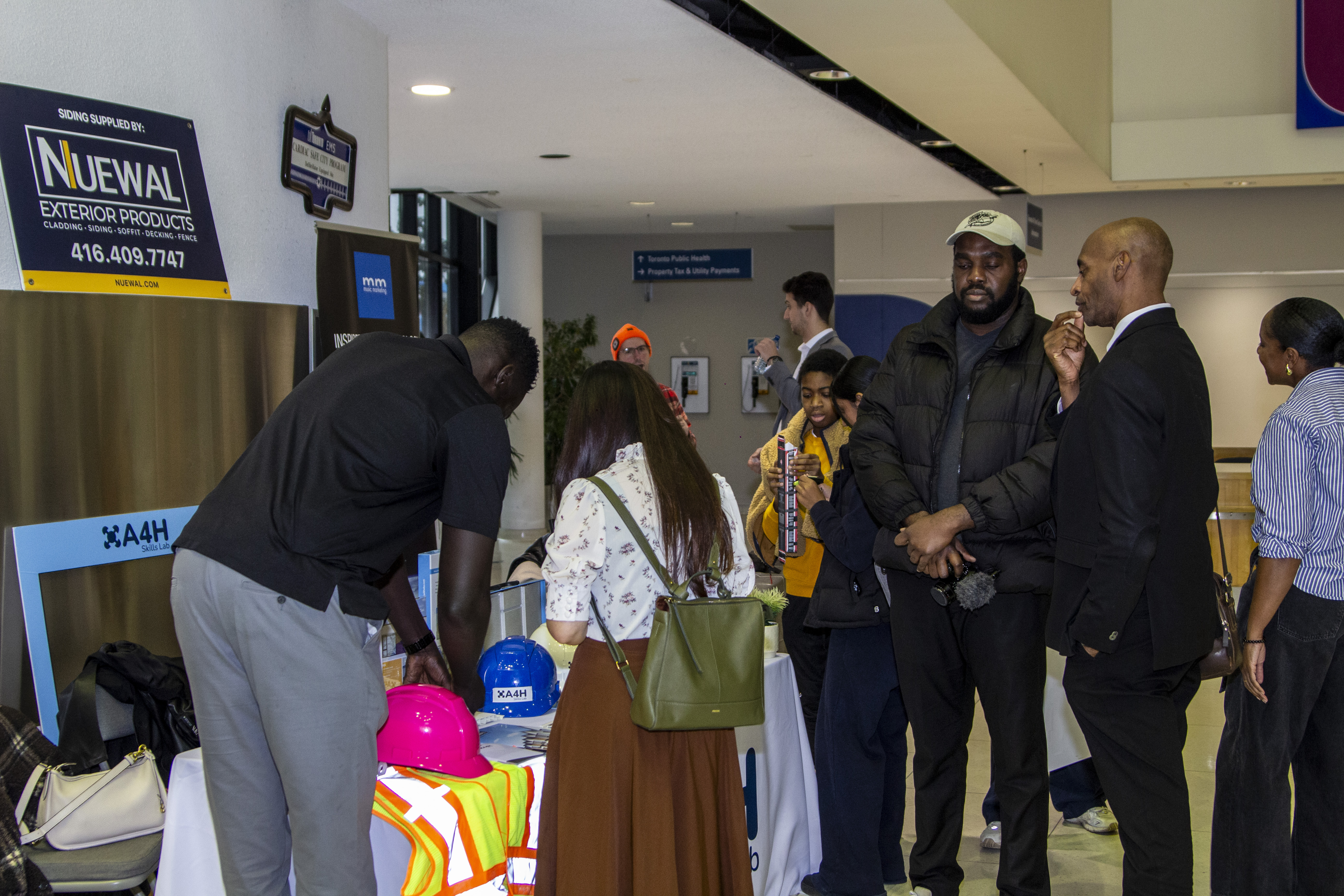 Attendees visiting the Music Marketing booth